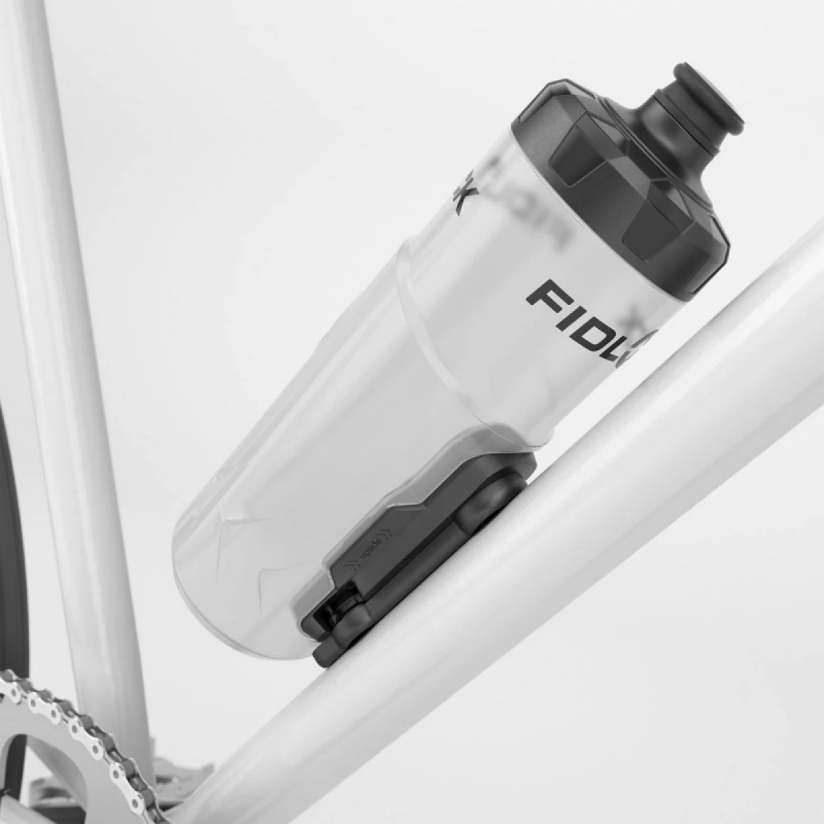 Fľaša na bicykel FIDLOCK set láhve s držákem BOTTLE TWIST průhledná bílá 600 ml · záber 2