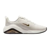 Dámska športová obuv (tréningová) NIKE Bella 7 W phantom metallic gold black sail · záber 1
